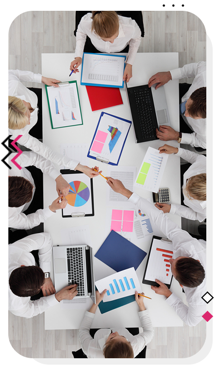 Digital marketing team working at a large table.