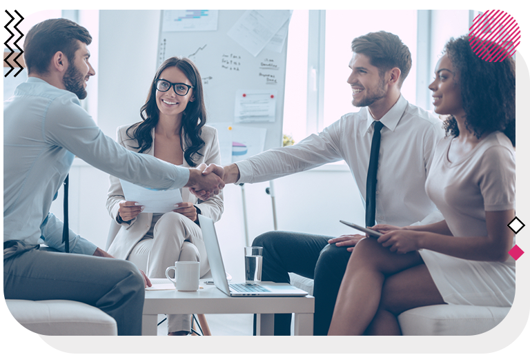 Team of digital marketers closing a deal and shaking hands with a client.