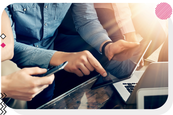 Colleagues using mobile devices, tablets, and laptops.