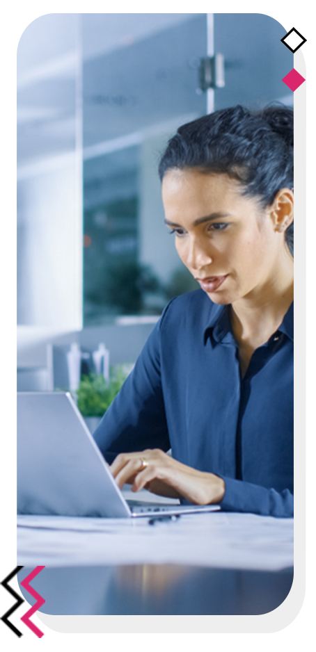 Focused woman writing content on her laptop.