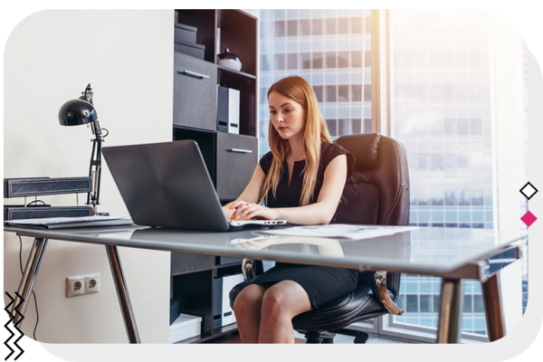 woman working on a computer in her office