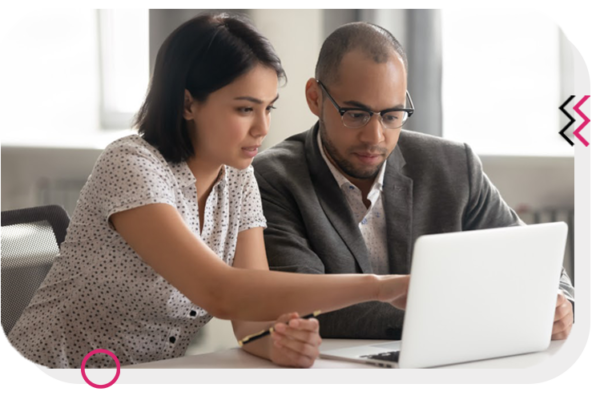 Two people pointing at a laptop