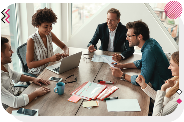 Group of people at a table talking and looking at each other