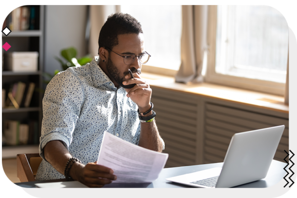 Man looking at his computer with a puzzled look on his face