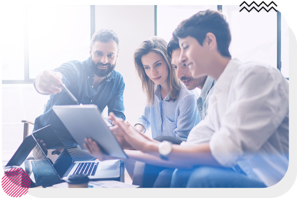 Group of people watching a woman use a tablet