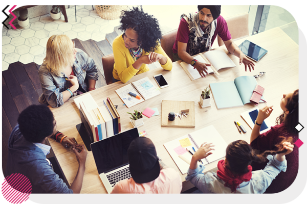 Group of people talking around a table