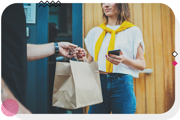 Person handing a bag to a woman