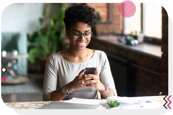 Woman looking at phone and smiling